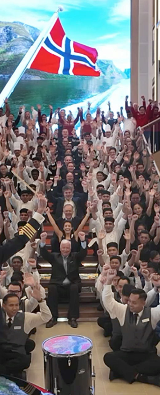Large crew group celebrating on grand staircase
