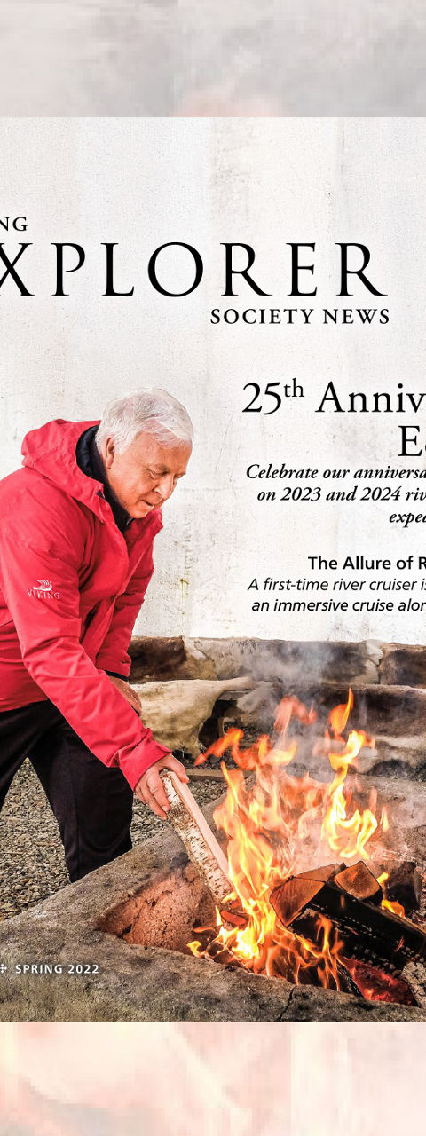 Person Tending Campfire Featured on Explorer Magazine Cover