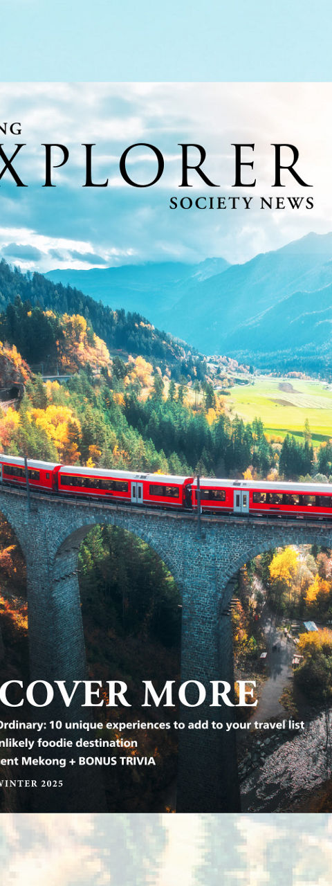 Travel Magazine Cover Featuring Scenic Mountain Train