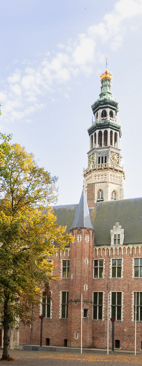 Historic European courtyard with church tower