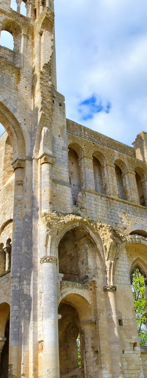 Ancient stone ruins under vibrant blue sky