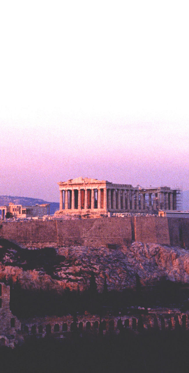 Acropolis at sunset with purple sky