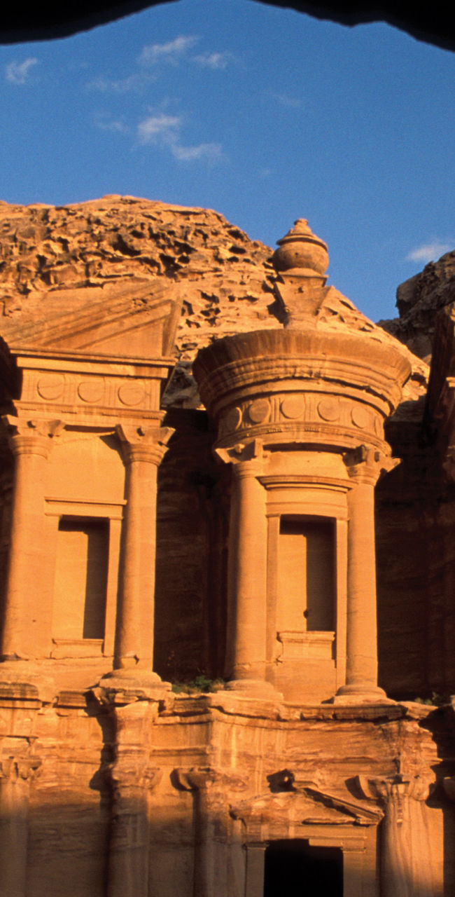 Ancient Petra Monastery framed by cave view