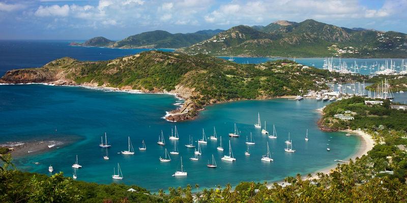 Scenic harbor with anchored sailboats