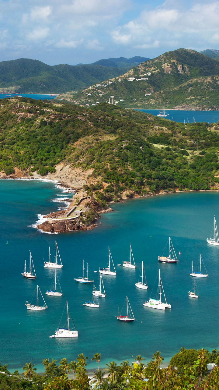 Scenic harbor with anchored sailboats