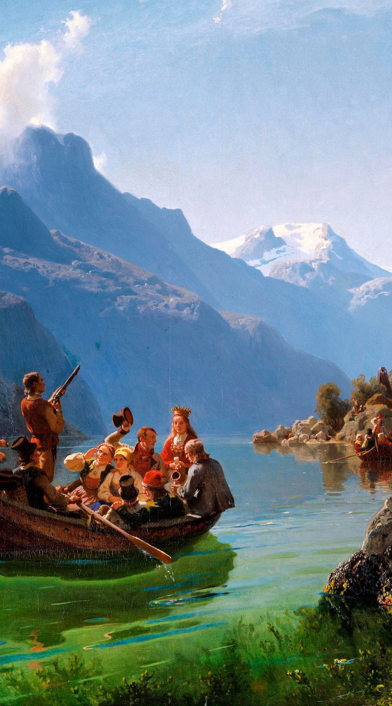 Group rowing boat in scenic mountain lake