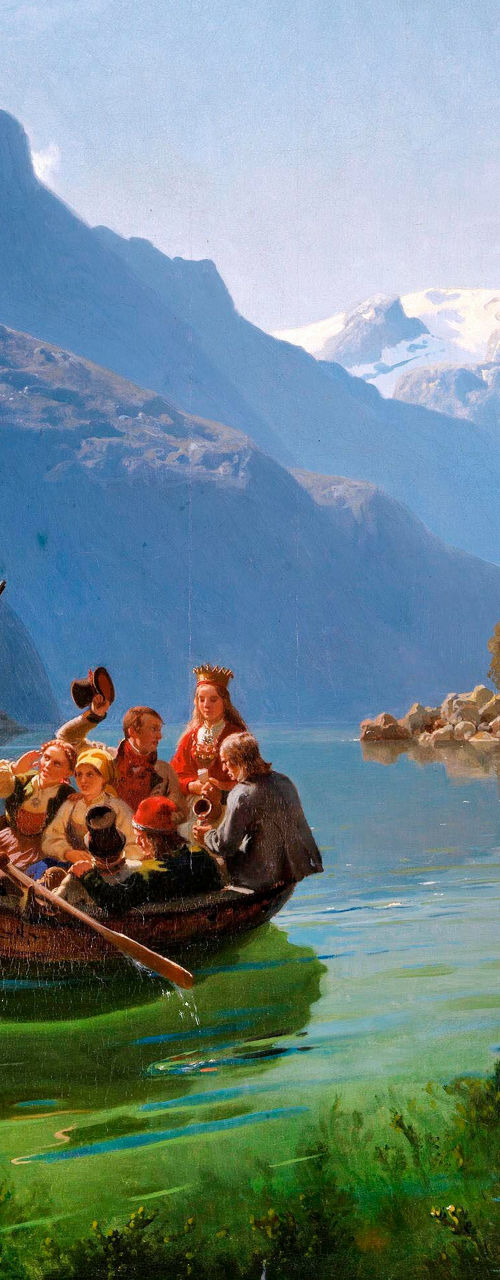 Group rowing boat in scenic mountain lake