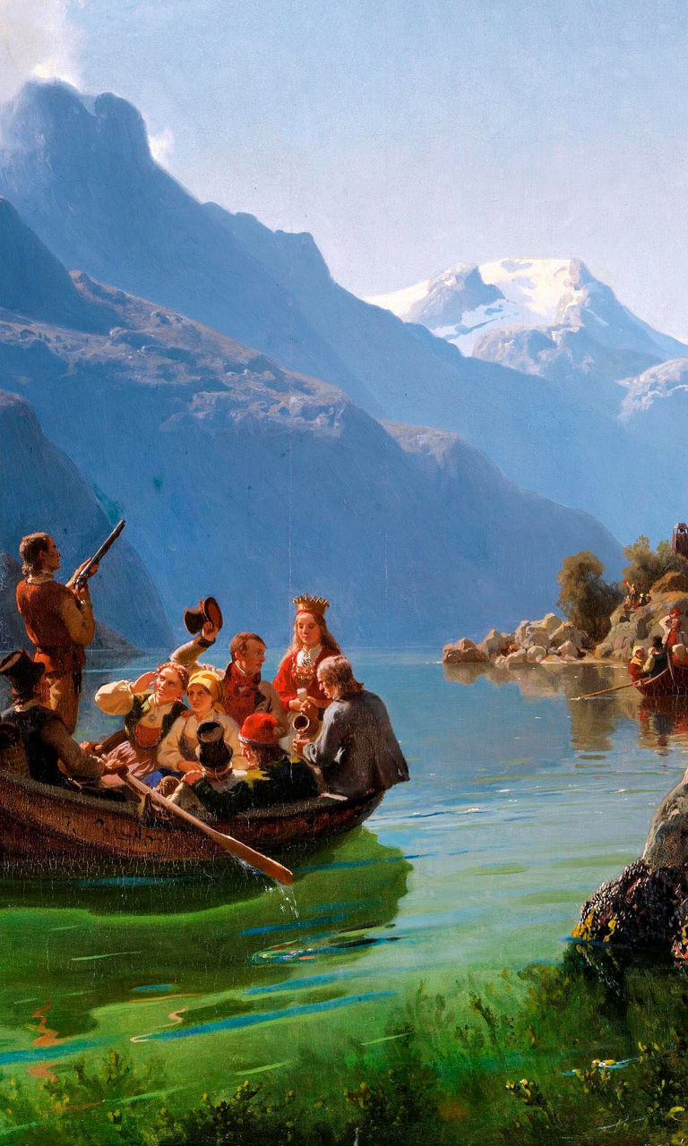 Group rowing boat in scenic mountain lake
