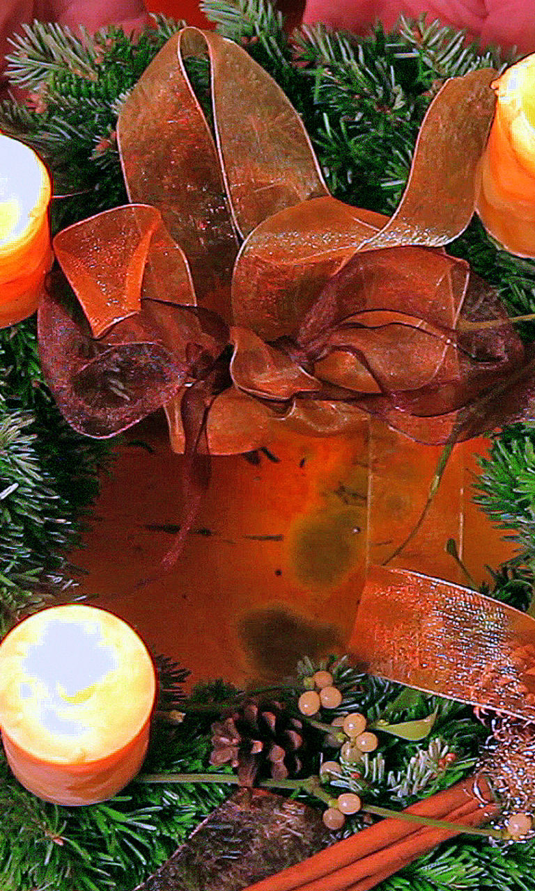 Festive wreath with glowing candles