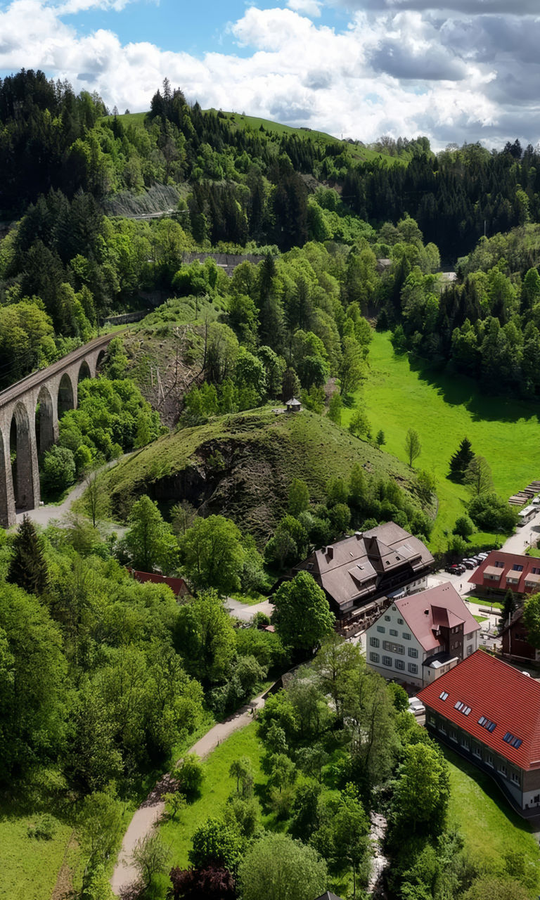 Scenic valley with bridge and buildings