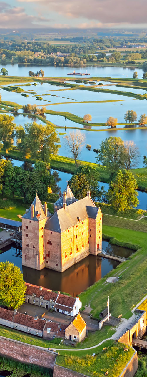 Aerial View of Historic Castle Surrounded by Moat