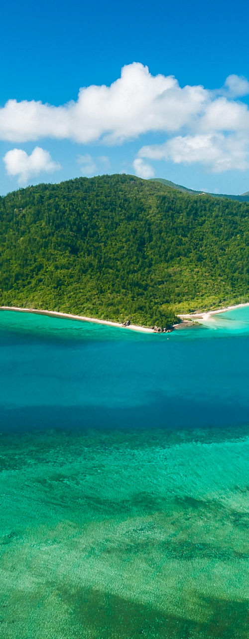 Tropical island surrounded by turquoise waters