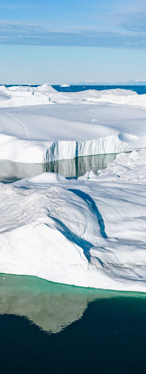 Majestic icebergs floating in Arctic waters