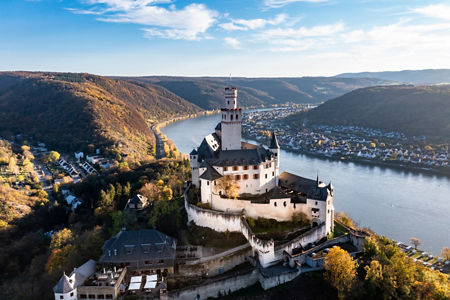 Hilltop riverside castle overlooking scenic valley