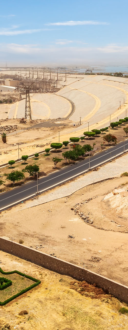 Coastal desert highway beside blue sea