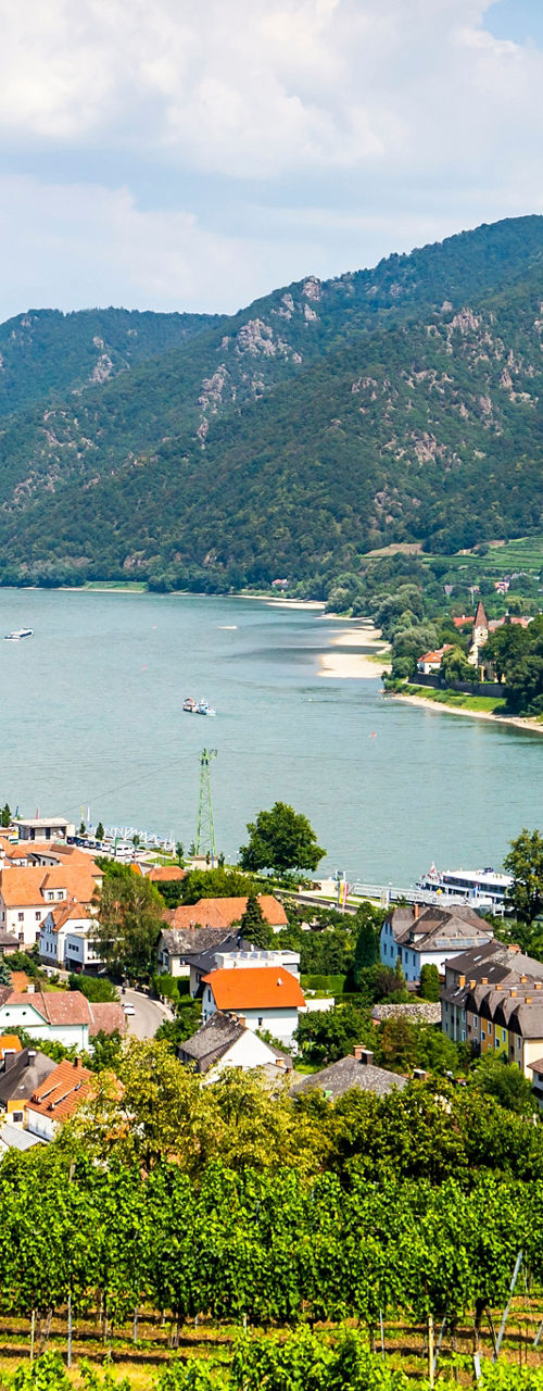 Scenic river valley with hillside village