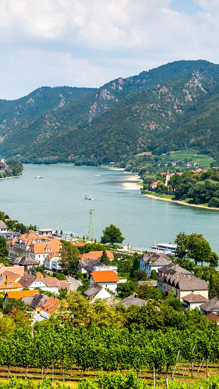 Scenic river valley with hillside village