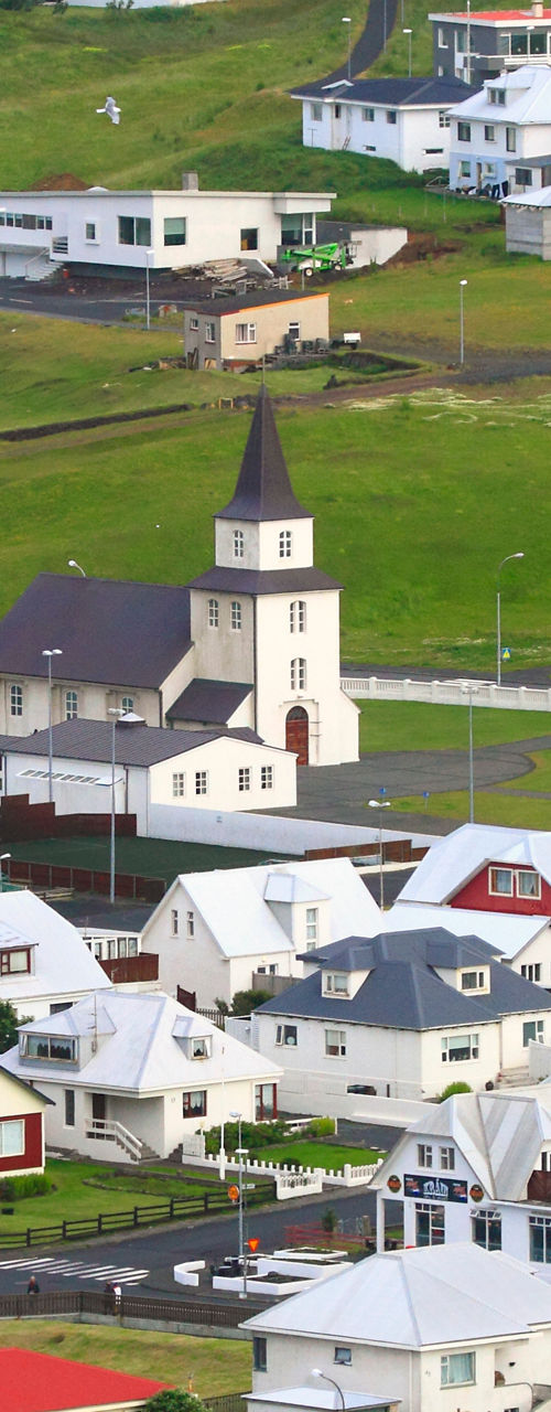 Scenic village with church and colorful rooftops