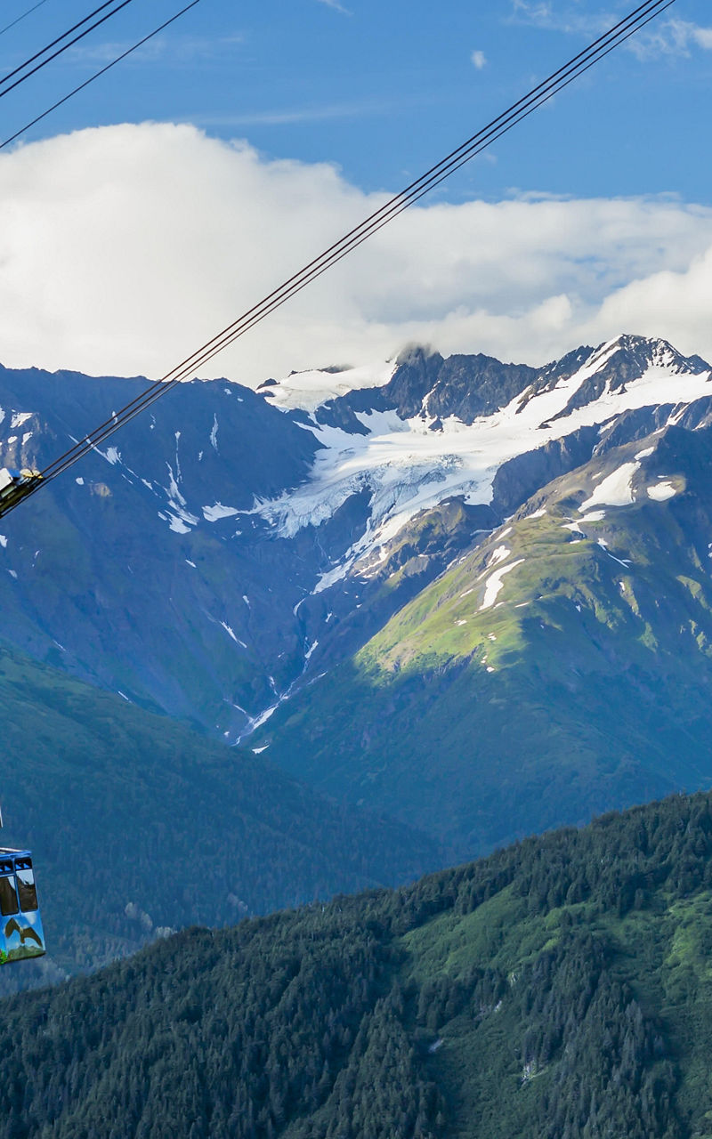 Cable car over scenic mountain landscape