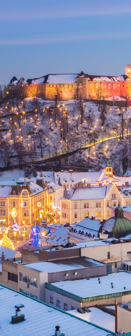 Ljubljana cityscape with castle at dusk