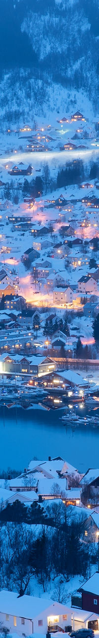 Snowy town illuminated at dusk