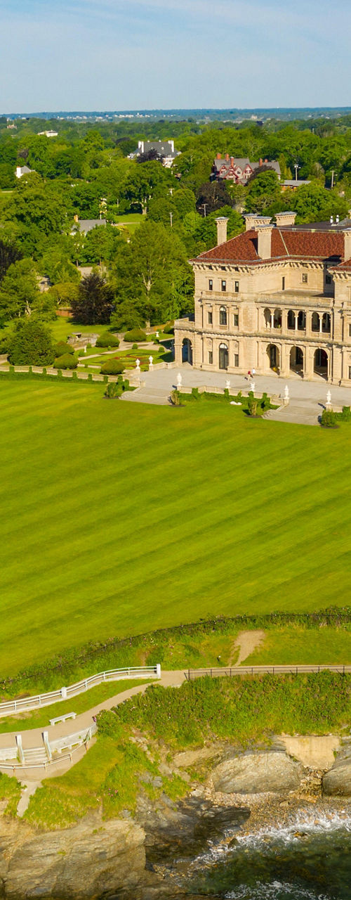 Aerial view of historic mansion by coastline