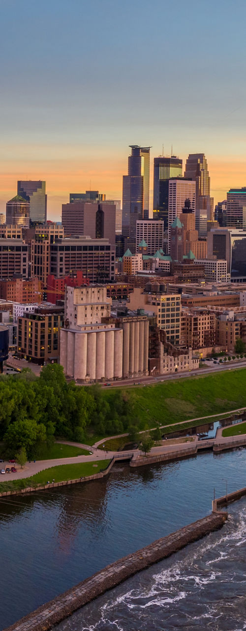 Minneapolis skyline at sunset with river view