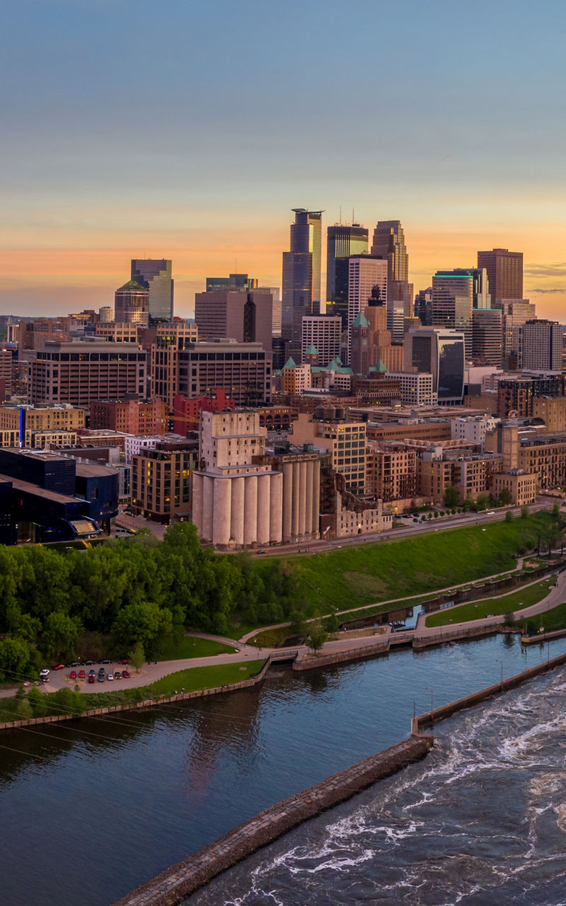 Minneapolis skyline at sunset with river view