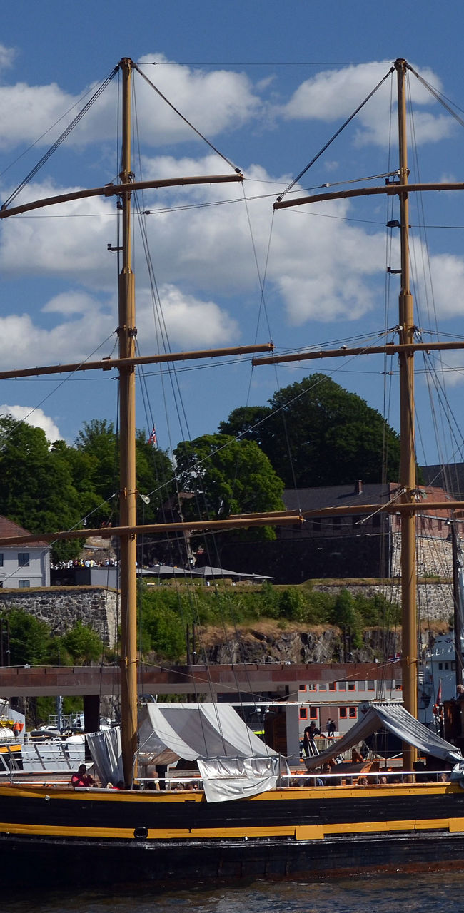 Historic sailing ship docked at harbor