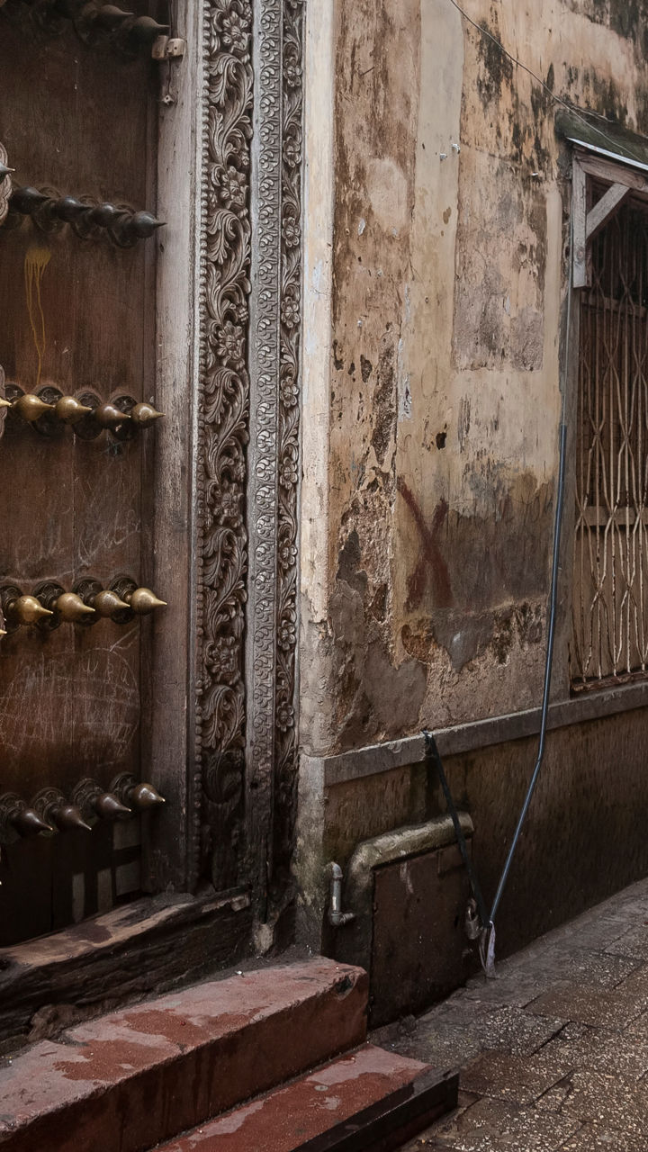 Man walking in historic alleyway