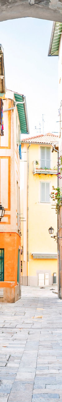 Colorful Italian alley with stone archway