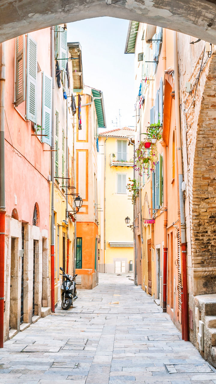Colorful Italian alley with stone archway