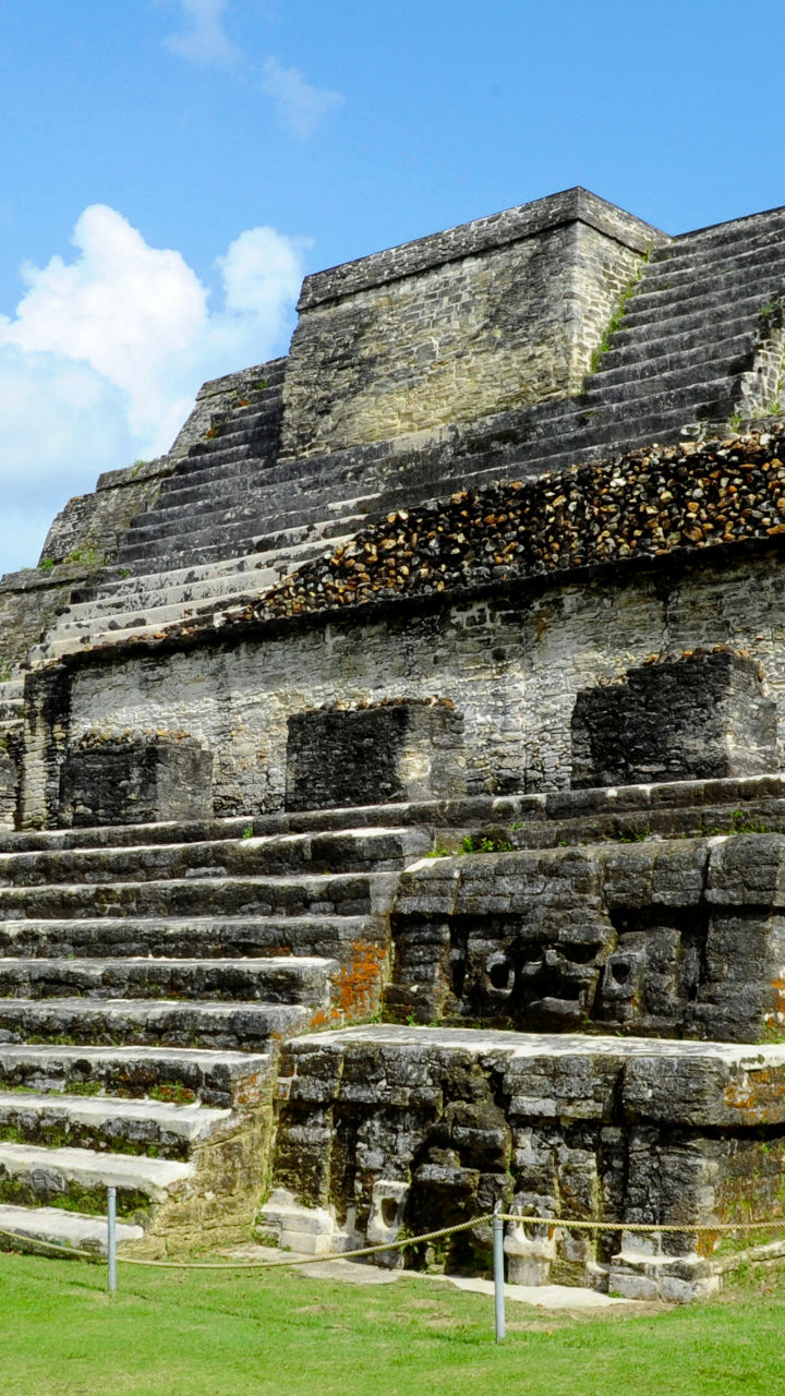 Ancient Mayan pyramid in lush landscape