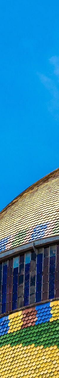 Colorful dome of historic building under blue sky