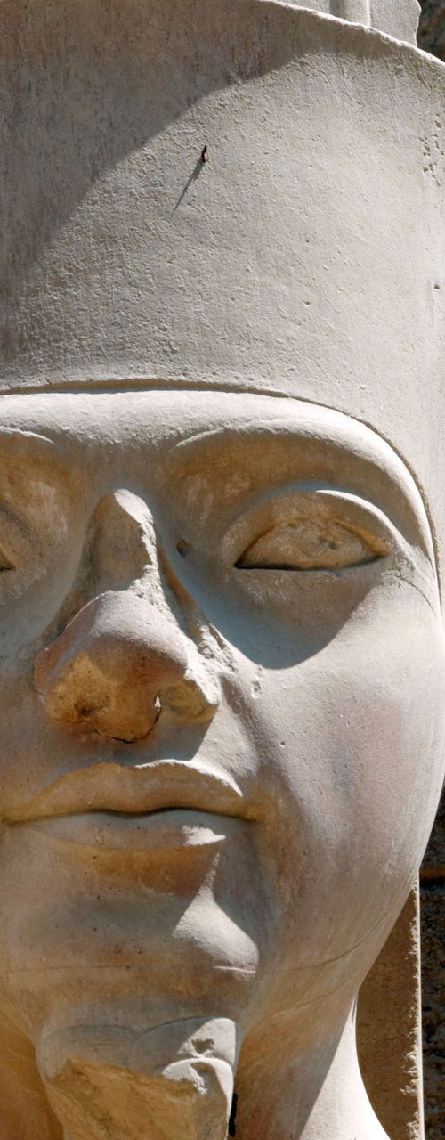 Ancient stone statue with intricate carvings