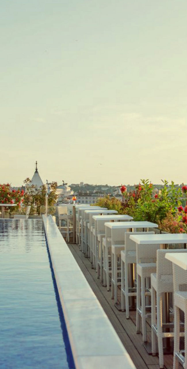 Rooftop infinity pool with scenic city view