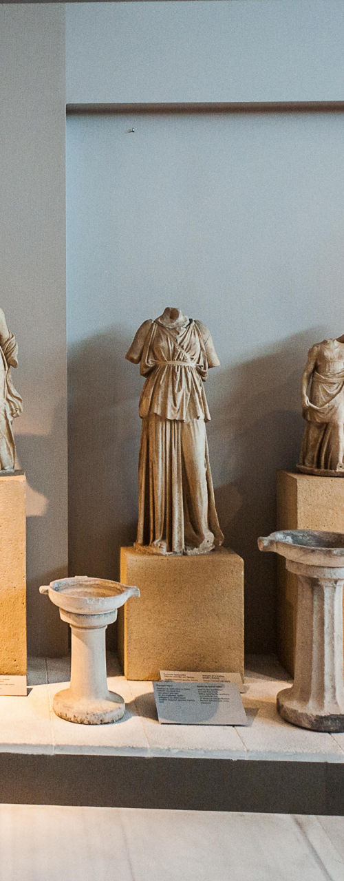 Ancient sculptures in museum gallery