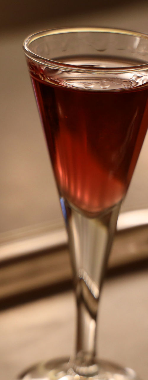 Three glasses of assorted beverages on tray