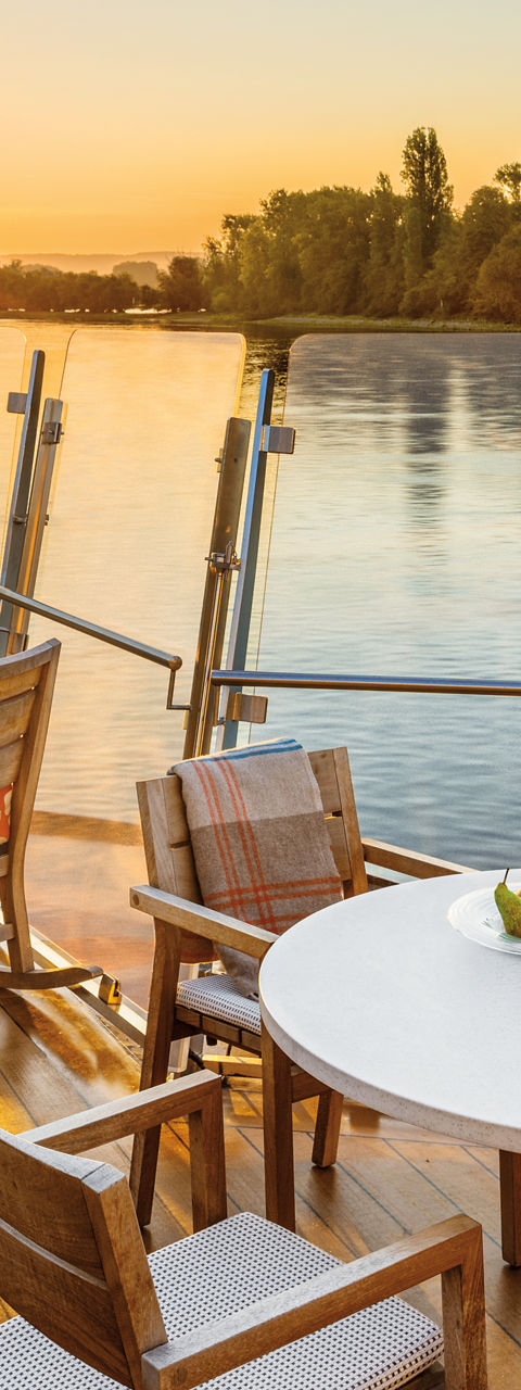 Riverside deck with sunset view
