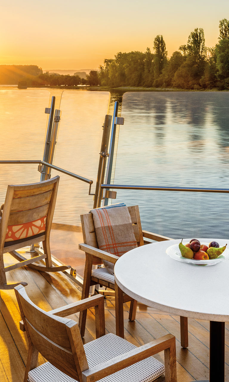 Riverside deck with sunset view