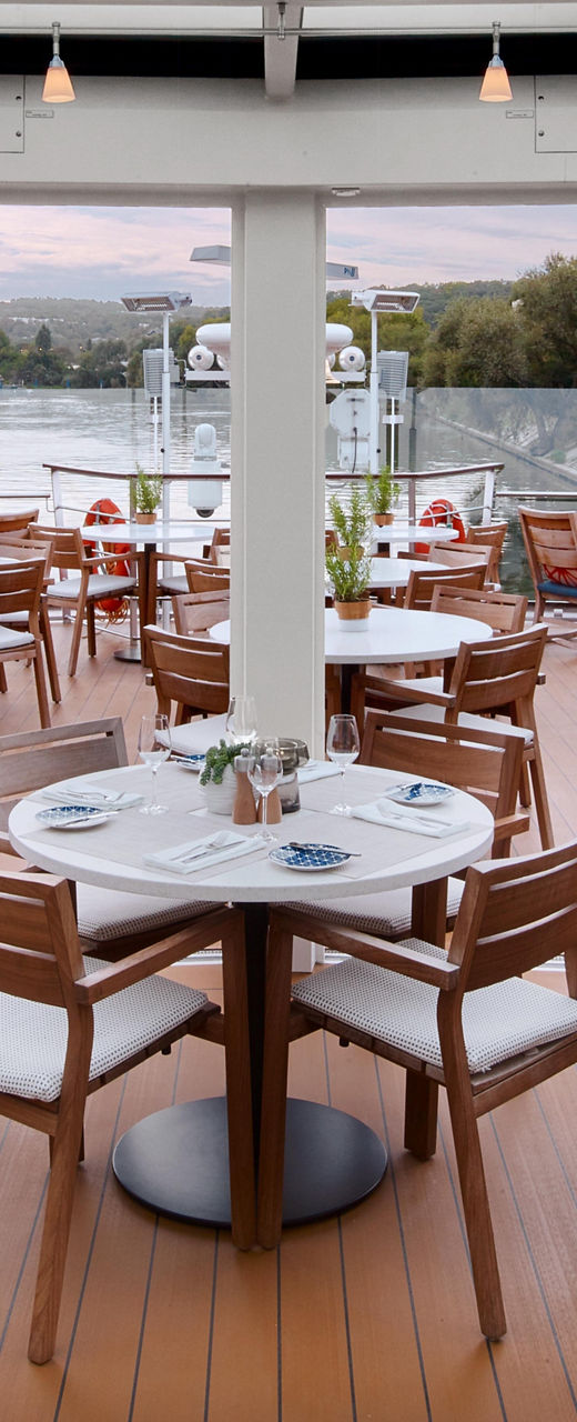 Modern outdoor dining area with glass roof
