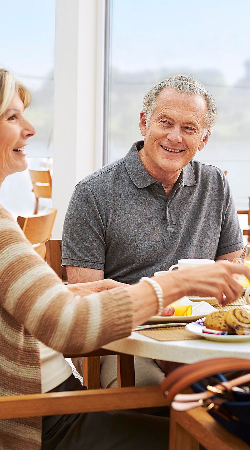 Group dining in bright cafe setting