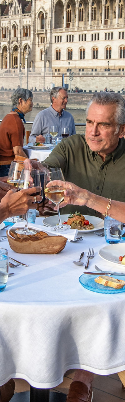 Group dining on river cruise deck