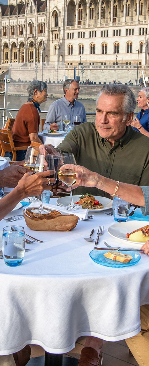 Group dining on river cruise deck