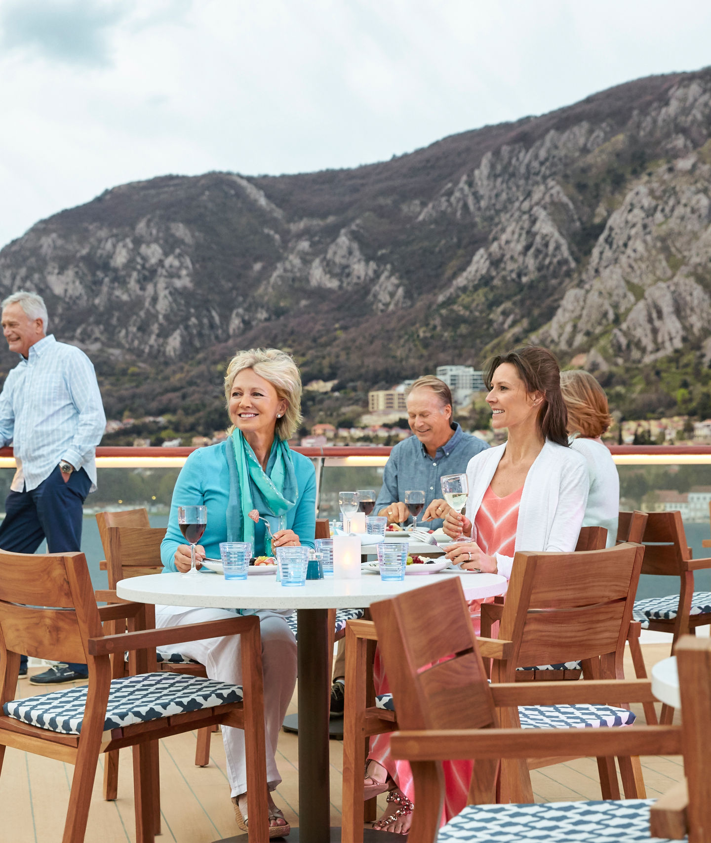 Group dining on scenic outdoor deck