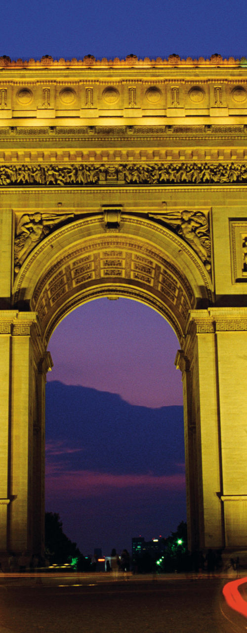 Arc de Triomphe at night with light trails