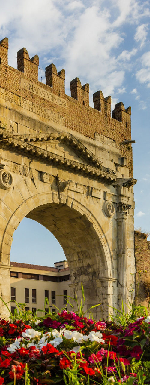 Historic Roman Arch with Floral Foreground