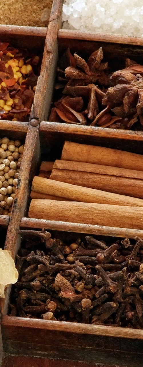 Assorted spices in wooden compartments