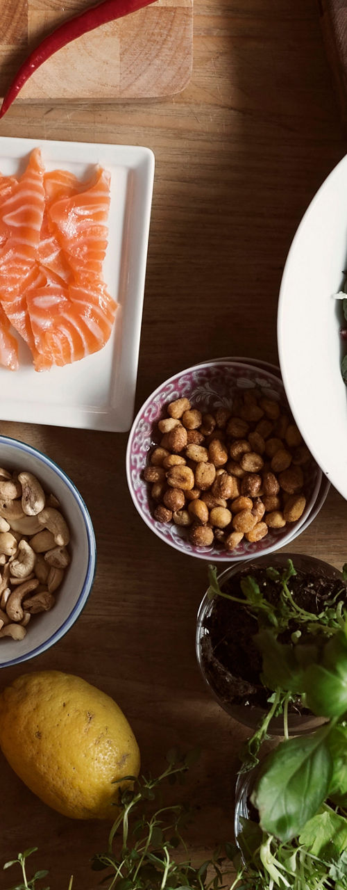 Fresh ingredients and dishes on wooden table