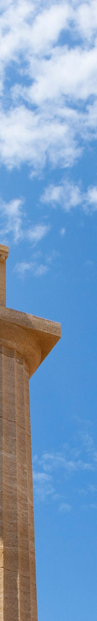 Ancient Greek columns under blue sky